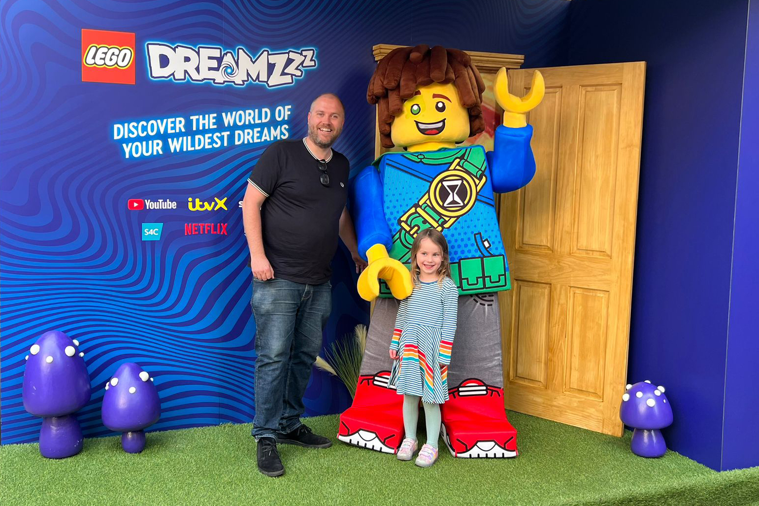 A father and daughter at the LEGO event